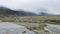 Tasman River and rain clouds at Mount Cook Valley, New Zealand