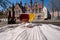 Tasting of Belgian beer on open cafe or bistro terrace with view on medieval houses and canals in Bruges, Belgium