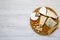 Tasting delicious cheese with walnuts, bread sticks and pretzels on wooden background, top view. Food for romantic. From above. F