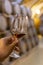 Tasting of fortified dry or sweet marsala wine in vintage wine cellar with old oak barrels in Marsala, Sicily, Italy