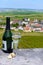 Tasting grand cru sparkling white wine with bubbles champagne with view on houses and vineyards grand cru wine producer small