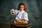 Tasting pizza. Portrait of little charming girl with curly hair in vintage blouse eating pizza over dark green