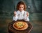 Tasting pizza. Portrait of little charming girl with curly hair in vintage blouse eating pizza over dark green