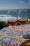 Tasting of sweet moscatel de setubal or porto portuguese wine and view on blue Atlantic ocean near Sintra in Lisbon area, Portugal