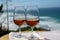 Tasting of sweet moscatel de setubal or porto portuguese wine and view on blue Atlantic ocean near Sintra in Lisbon area, Portugal