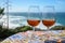 Tasting of sweet moscatel de setubal or porto portuguese wine and view on blue Atlantic ocean near Sintra in Lisbon area, Portugal