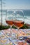 Tasting of sweet moscatel de setubal or porto portuguese wine and view on blue Atlantic ocean near Sintra in Lisbon area, Portugal