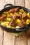 Tasty Aloo Gosht Recipe Mutton Curry with Potato closeup in the pan. Vertical