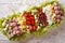 Tasty American Cobb salad close-up on a plate on the table. Hori