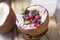 Tasty appetizing smoothie acai bowl made from blackberries and wild berries. Served in coconut bowl. Healthy life clean eating