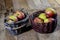 Tasty apples in basket on kitchen table. Autumn season. Wooden t