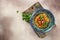 tasty Asian pilaf in plate with oriental ornament, Uzbek oriental cuisine on a light background top view. place for text