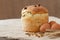 Tasty backed traditional russian kulich easter cake with raisins and eggs on vintage textile