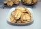 Tasty baked buns on the plates on the table in kitchen