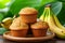 Tasty banana muffins with inviting aroma on blurred background and copy space for text placement