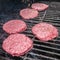 Tasty beef burgers on the grill