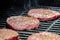 Tasty beef burgers on the grill