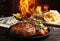 Tasty beef steak and flame on wooden table