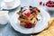 Tasty belgian waffles with vanilla ice cream and berries