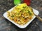 Tasty Bhelpuri is a savoury snack or chaat. It is made out of puffed rice, vegetables and a tangy tamarind sauce