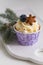 Tasty blueberry muffin with cream on white wooden table, Christmas dessert