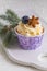 Tasty blueberry muffin with cream on white wooden table, Christmas dessert