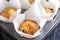 Tasty blueberry muffins in baking tin, closeup