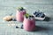 Tasty blueberry smoothie in jars, berries