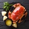 Tasty boiled whole brown crab with sauce, lemon and parsley on a