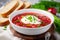 Tasty borscht with sour cream served. Generate Ai