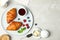 Tasty breakfast with croissants served on grey marble table, flat lay. Space for text