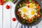 Tasty breakfast. Fried eggs with vegetables. Shakshuka.