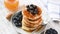 Tasty breakfast pancakes with blueberry and honey