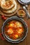 Tasty Breakfast Shakshuka in a Iron Pan. Fried eggs with tomatoes, Healthy Food.