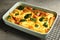 Tasty broccoli casserole in dish on cooling rack