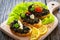 Tasty bruschetta with tapenade on wooden table