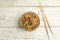 Tasty buckwheat noodles with meat on wooden table, flat lay