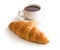 Tasty buttery croissant and cup of coffee.