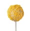 Tasty cake pop with yellow sprinkles on white