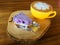 Tasty Capucino art coffee with blue berry cheese cake on wooden place