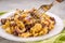 Tasty cellentani pasta with meat sauce