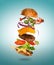 Tasty cheeseburger with flying ingredients on color pastel background
