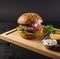 Tasty cheeseburger wooden board ready be served. High quality and resolution beautiful photo concept