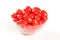 Tasty cherry tomatos in a bowl, white background