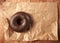 Tasty chocolate doughnut on a paper
