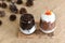 Tasty cocoa drink with chocolate dessert bar. Summer refreshment drinks. Chilled iced chocolate cocoa on Sackcloth with Pine cones