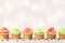 Tasty colorful cupcakes closeup on bokeh background with copy space. Birthday party sweets
