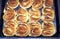 Tasty cooked baking on kitchen tray closeup