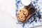 Tasty cookies, bowl with chocolate chips and glass of milk on table