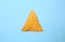 Tasty corn chip on color background